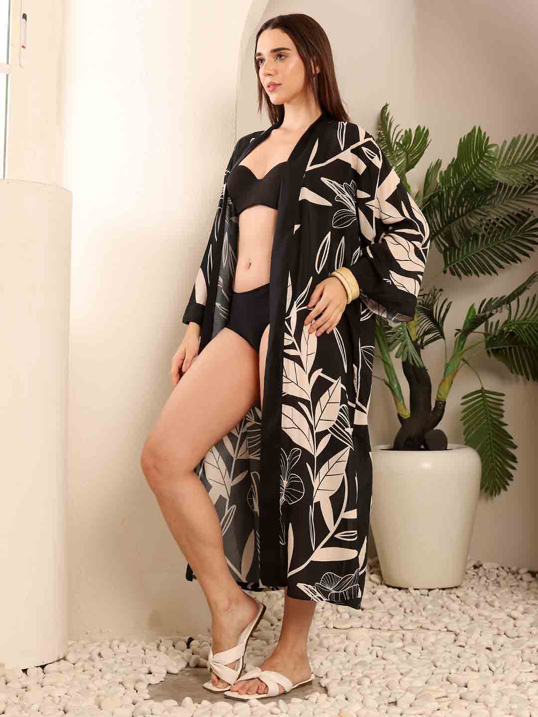left Side view of Black Floral beach coverup displaying the relaxed fit and natural drape