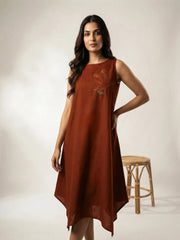 Women wearing a copper summer resort dress with bird embroidery and high low hemline