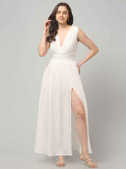 Front profile of a women wearing Crinkled Cotton white Flowy resort maxi dress with Front Slit