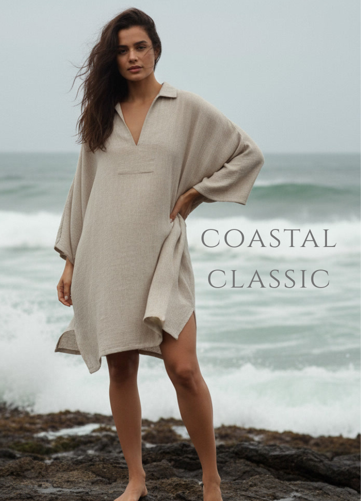 Woman in a beige dress standing on a rocky beach with ocean waves in the background, text 'Coastal Classic' displayed.