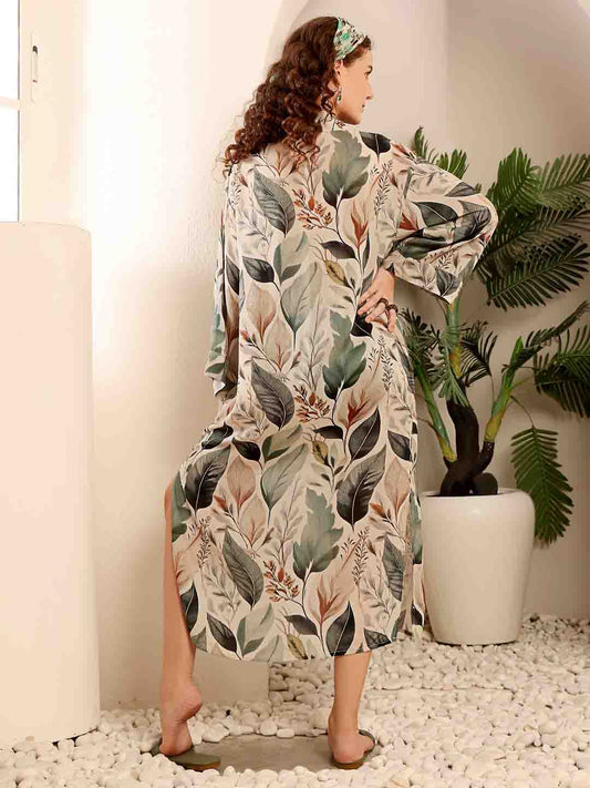 Back view of Beige Floral beach coverup highlighting the flowy silhouette and print detail