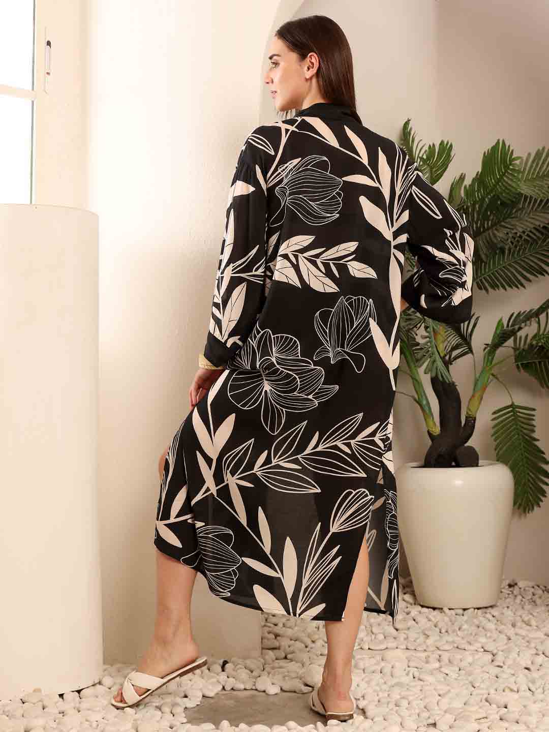 Back view of Black Floral beach coverup highlighting the flowy silhouette and print detail