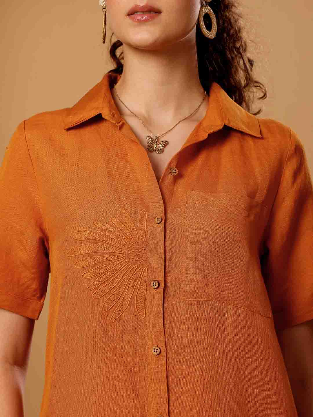 Front close-up of Burnt orange Resort dress shirt showing intricate embroidery and neckline detail