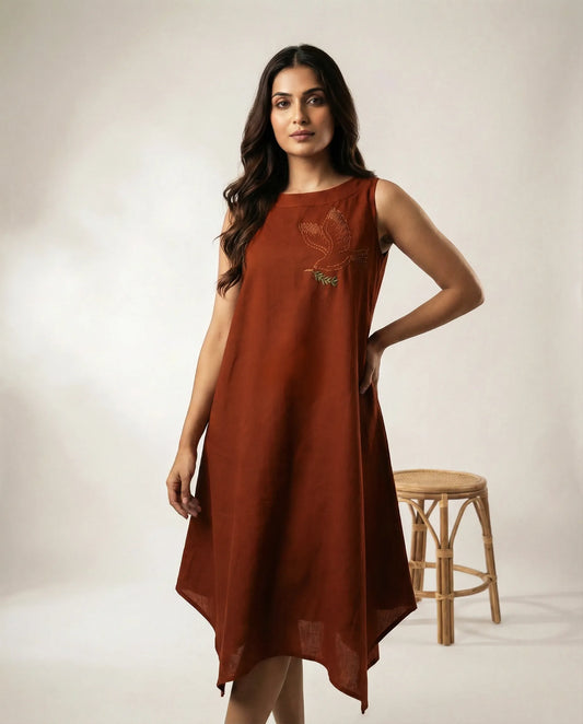 Women wearing a copper summer resort dress with bird embroidery and high low hemline