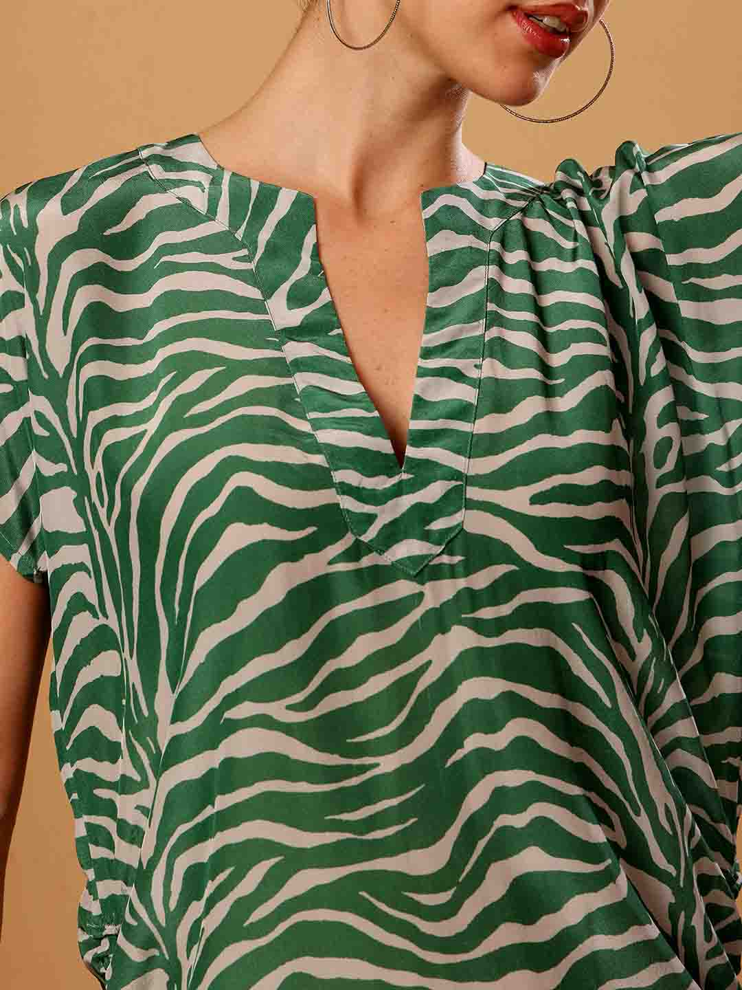 Close-up of Green animal print beach coverup emphasizing fabric texture and detailed finish
