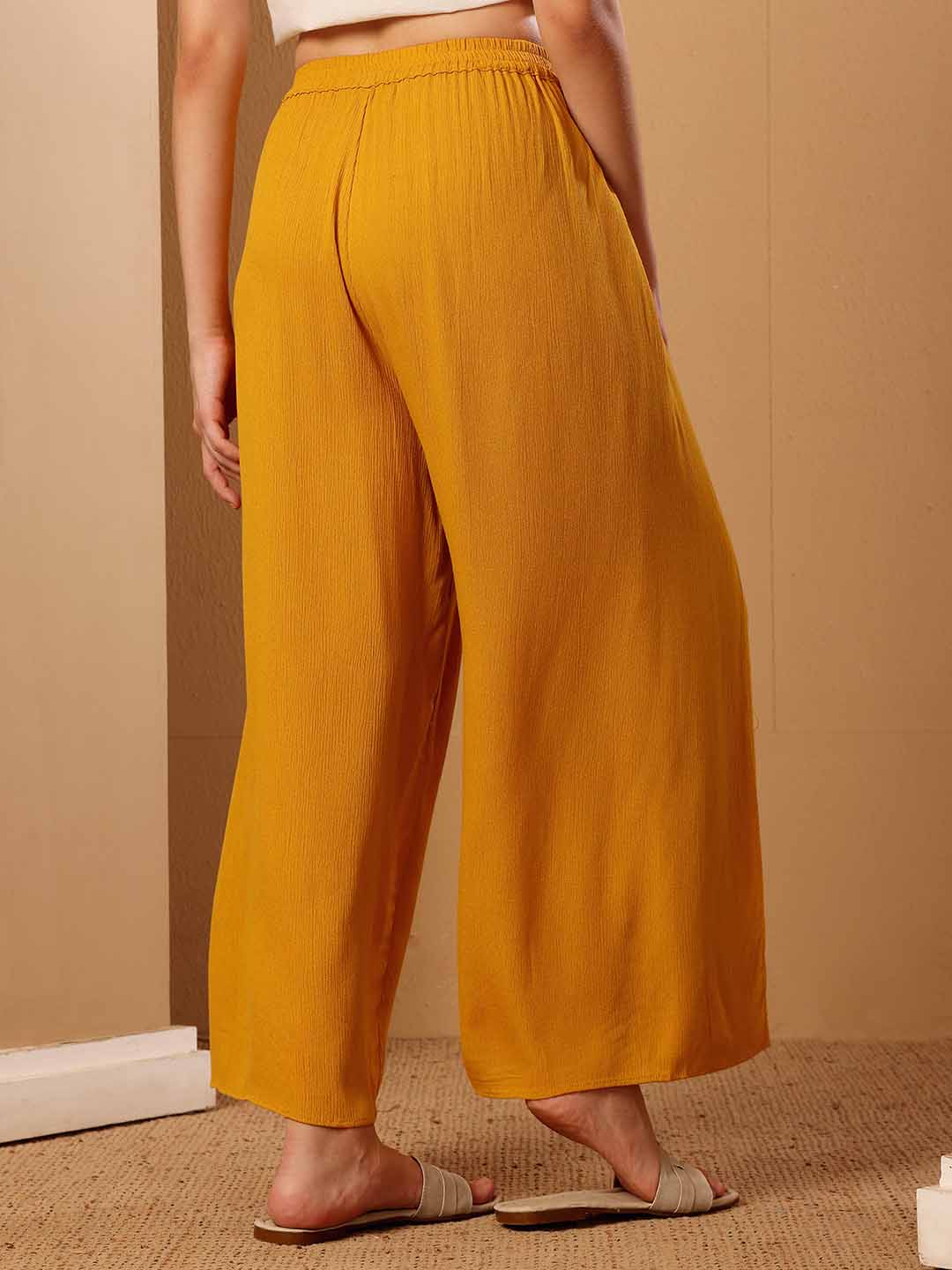 back view of mustard resort Slit Pant displaying the silhouette and design clearly
