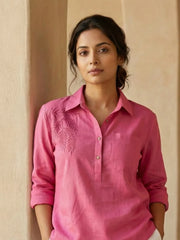 Close up short of a women wearing Linen Blend summer co-ord set -  pink beach shirt with Embroidery and White Shorts with drawstring and pockets