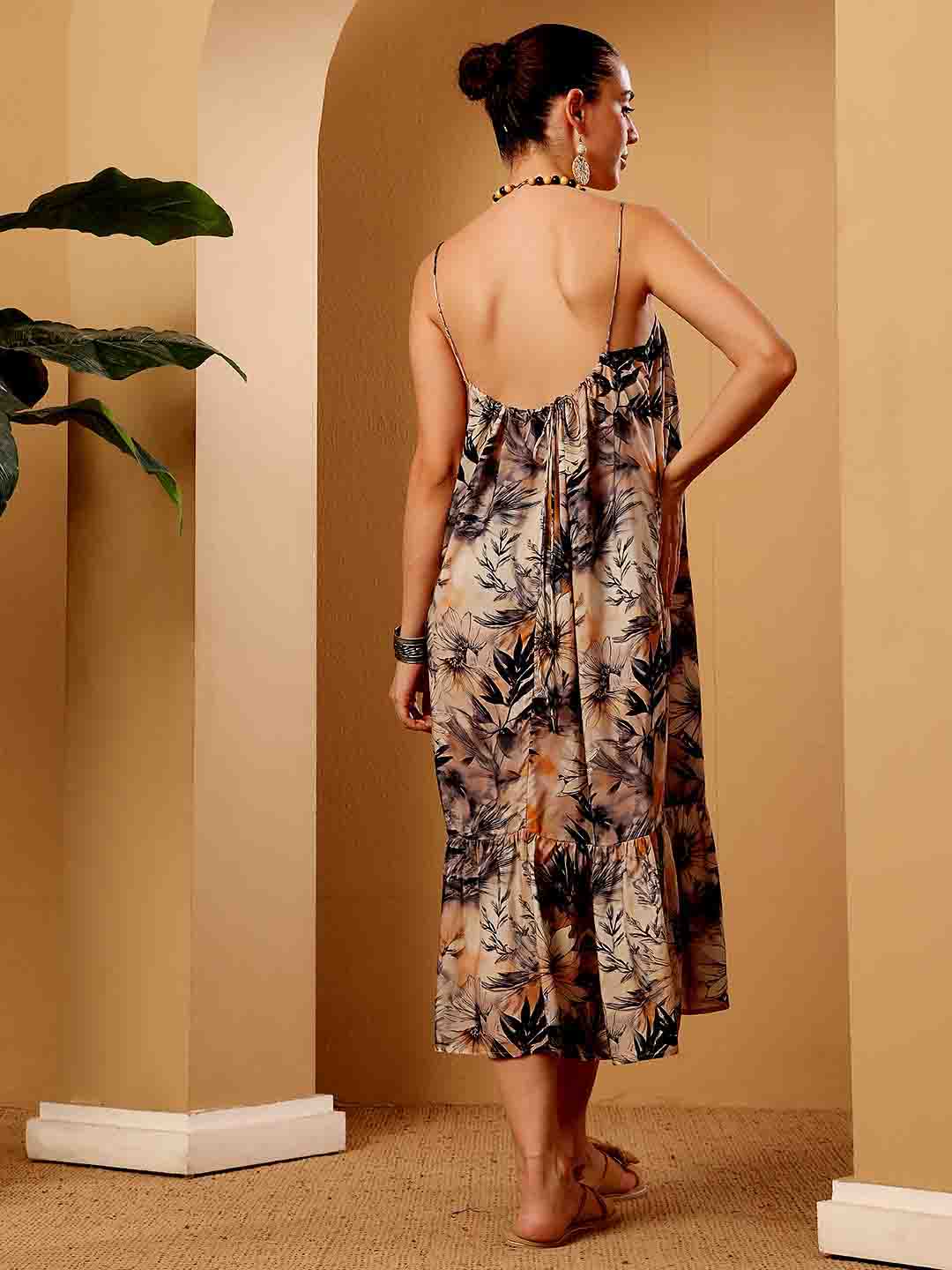Back view of tropical floral resort dress highlighting structure and styling from the rear