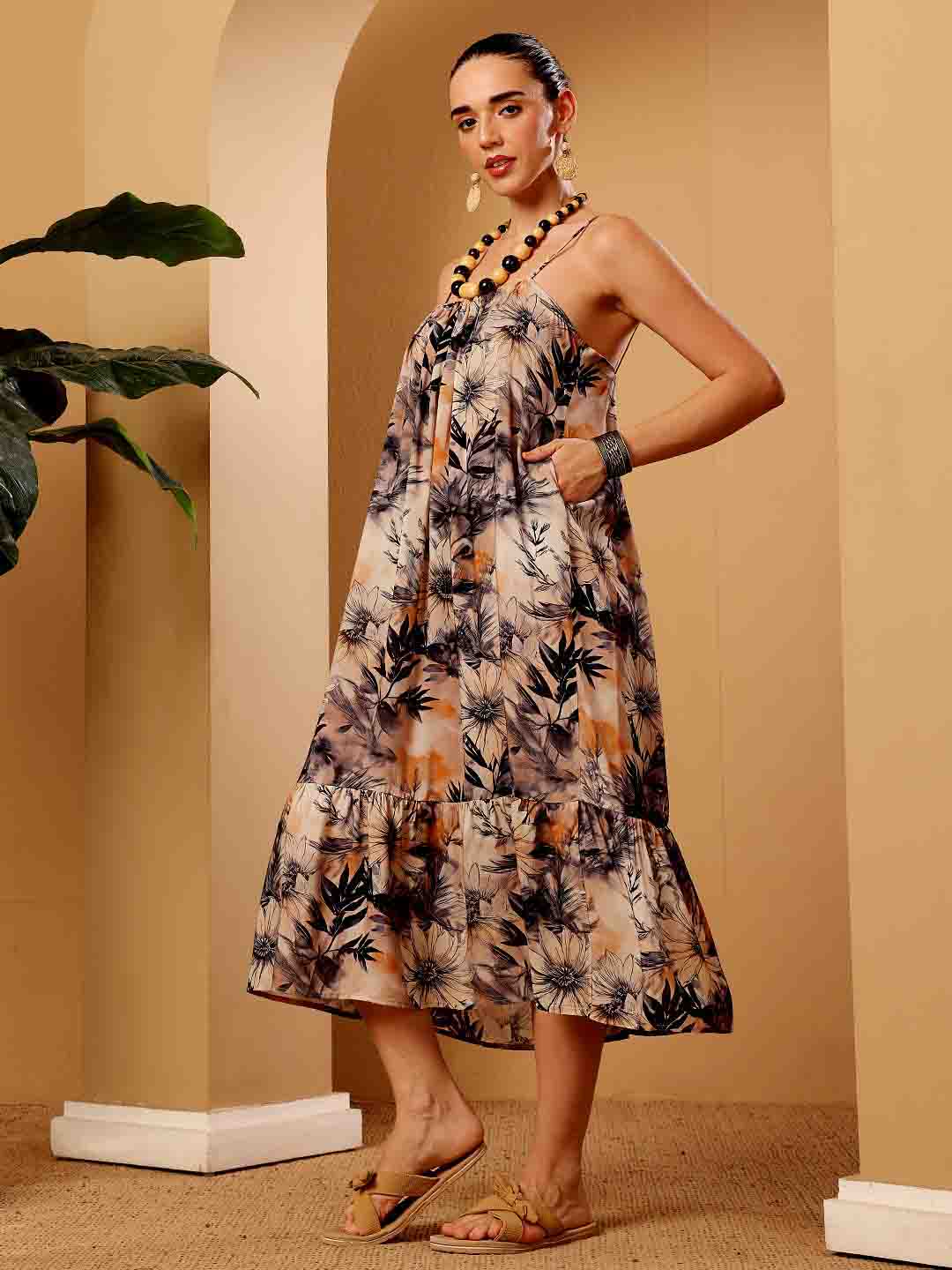Side view of tropical floral resort dress focusing side pockets,  drape and contour
