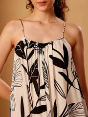 Front close-up of tropical printed resort maxi dress showing intricate fabric and neckline detail
