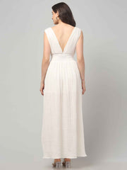 Back profile of a women wearing Crinkled Cotton white Flowy resort maxi dress with Front Slit