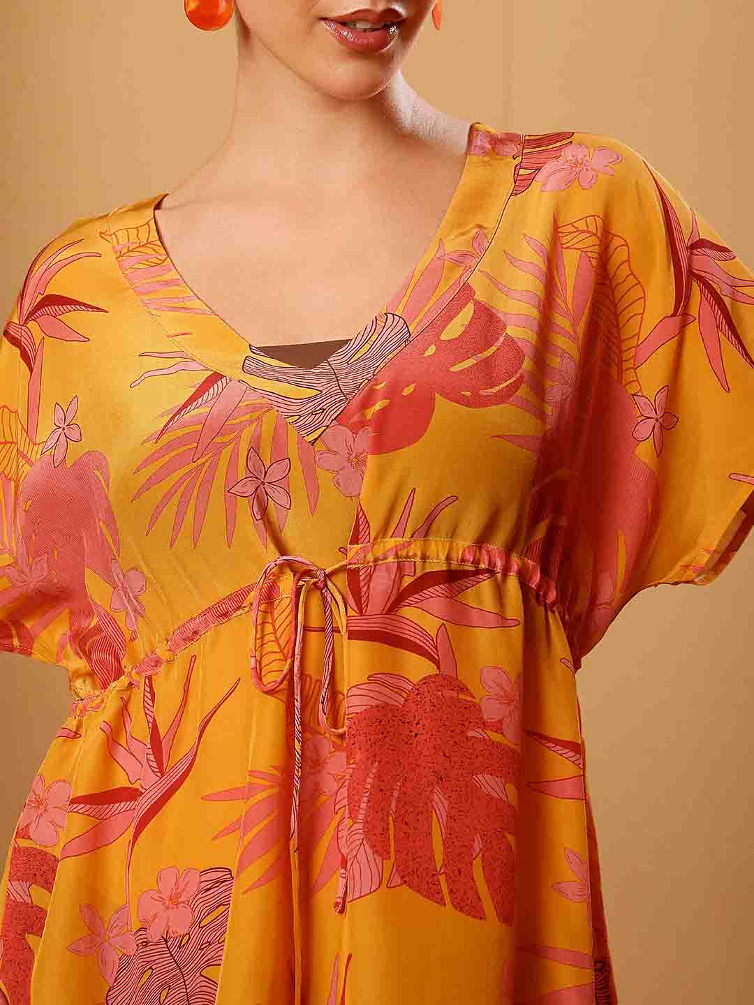 Close-up of Yellow printed beach coverup emphasizing fabric texture and detailed finish